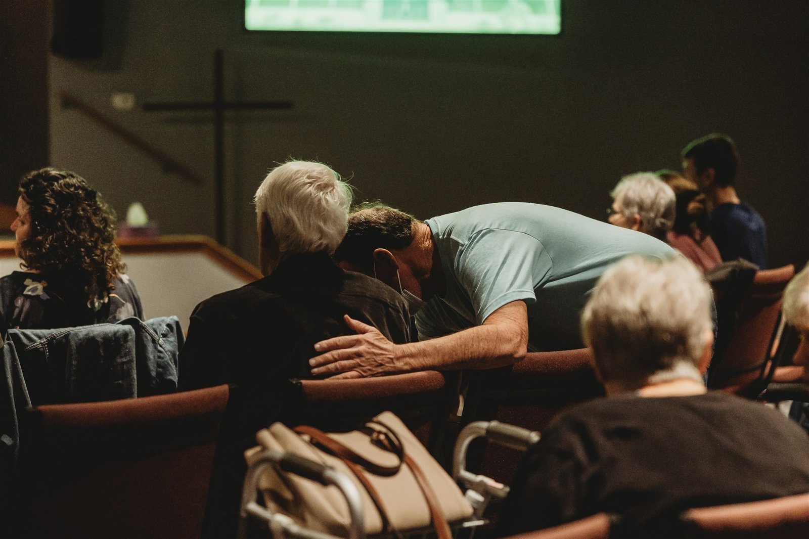 A photo of two people praying together